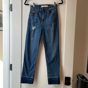 Distressed straight leg blue jeans